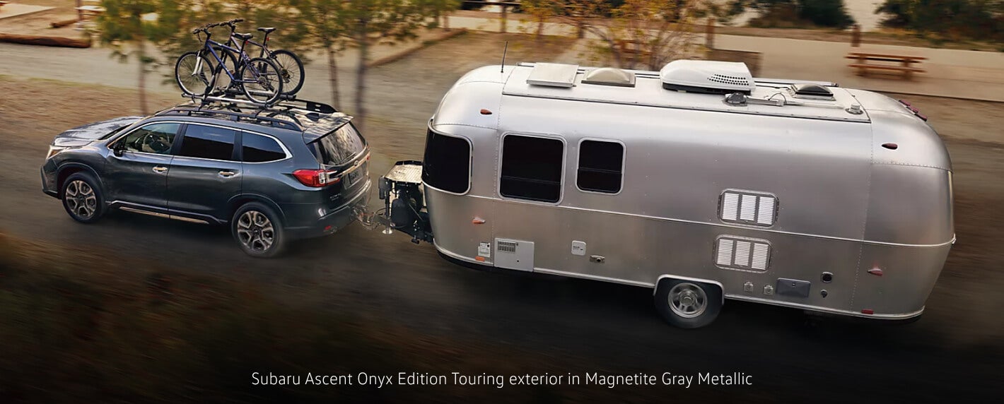 Subaru Ascent Onyx Edition Touring exterior in Magnetite Gray Metallic towing an Airstream trailer