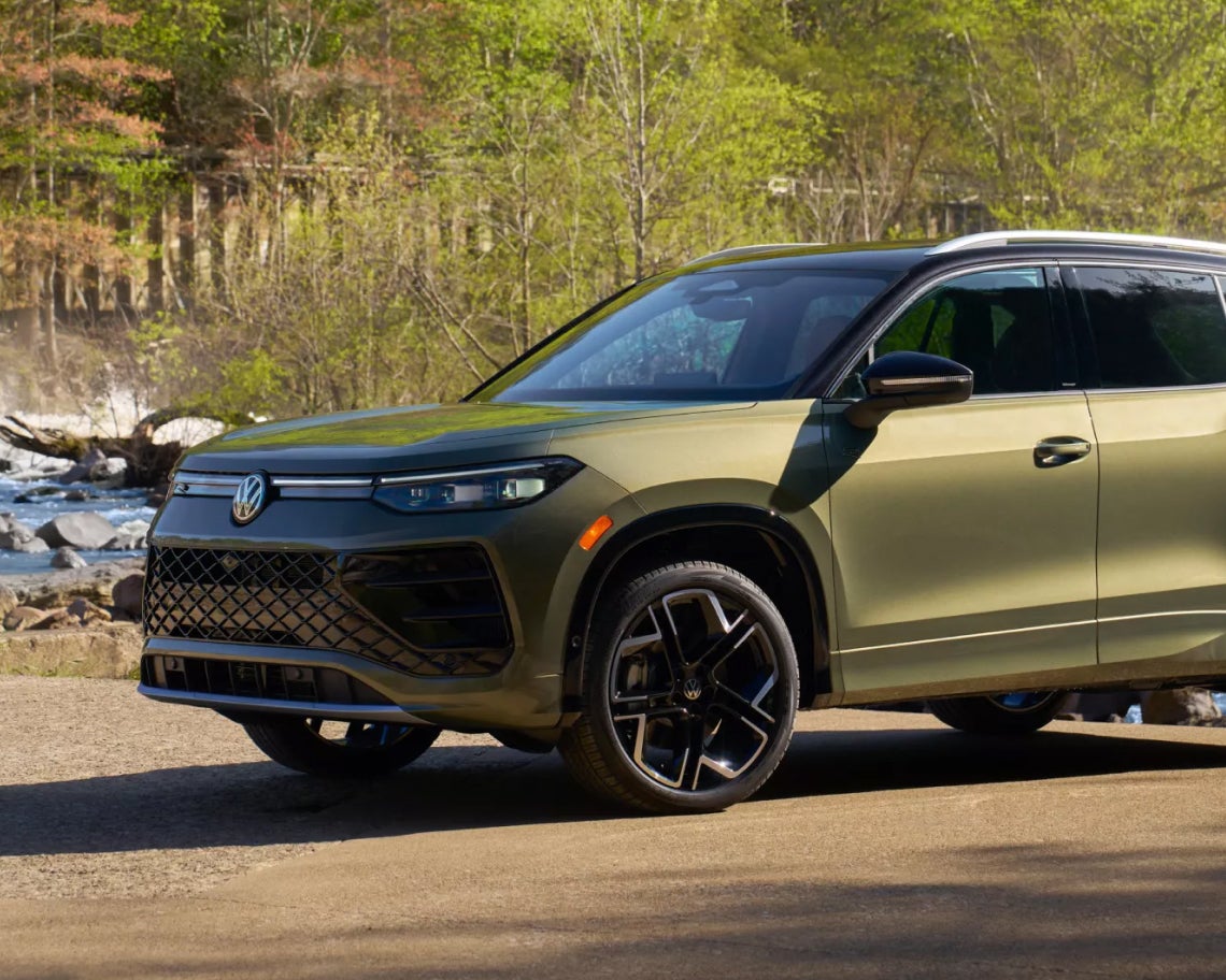 Volkswagen Tiguan in front of small pines